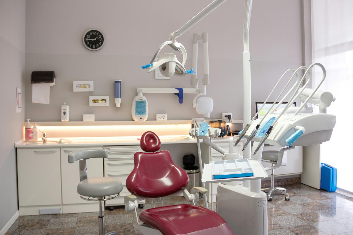 Patient with a bright, confident smile in a modern dental clinic